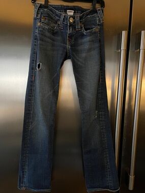 True religion classic boot cut dark blue jeans. Distressed from company